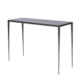 A wrought iron console in the manner of Jean-Michel Frank .