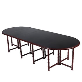 A French faux bamboo dining room table in the manner of Maison Jansen C 1960.