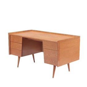 A rare and early white oak MCM desk labeled Risom Design circa 1950.