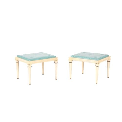 A pair of French foot stools in the manner of Andre Arbus C 1950 .: A pair of French foot stools in the manner of Andre Arbus C 1950 . These light blue upholstered foot stools have wooden frames with brass mounts on turned tapering legs. Andre Arbus (1903-1969) was a