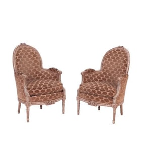 A pair of French Louis XVI style painted armchairs or bergeres C 1920.