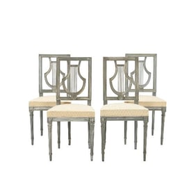 A set of four French Louis XVI style painted chairs Lyre model C1900.