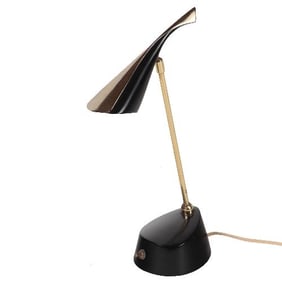 A MCM futuristic black enameled metal and brass Laurel desk lamp circa 1950.