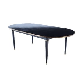 A French ebonized mahogany dining table attributed to Maison Jansen C 1940.