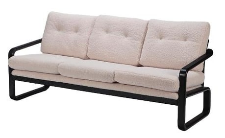 An ebonized and upholstered sofa 20th C.