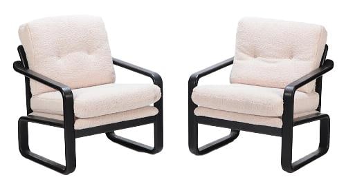 A pair of French ebonized open armchairs 20th C.