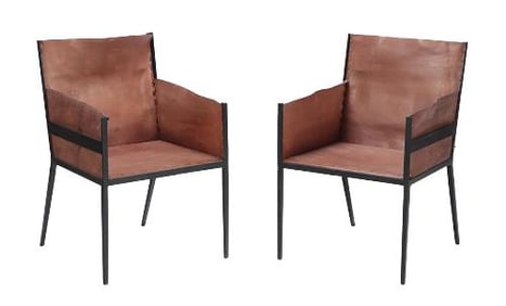 Pair of  iron and tailored leather armchairs in the manner of Jean-Michel Frank  .