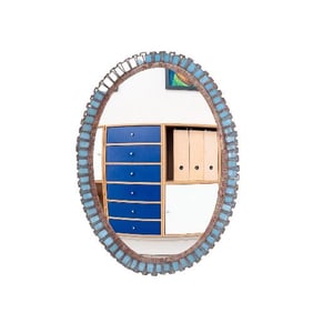 An oval resin and light blue glass mirror in the manner of Line Vautrin