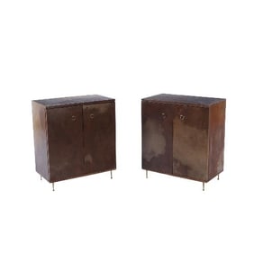 A pair of parchment covered cabinets C 1950.