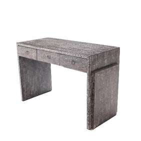 A dark cerused oak desk in the manner of Jean-Michel Frank  .