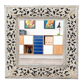 A modern silver gilt carved wood mirror .