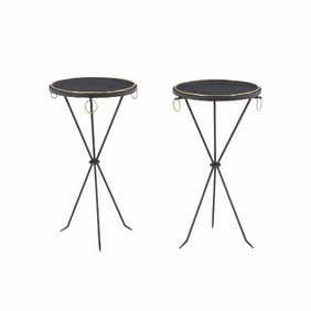 A pair of Gueridon style wrought iron drinks tables .