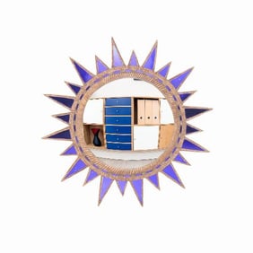 A large purple glass and resin convex sunburst mirror in the manner of Line Vautrin .