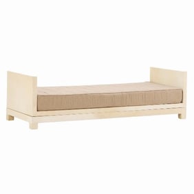 A parchment covered daybed in the manner of Jean-Michel Frank  .