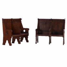 A pair of American Gothic style carved oak double benches C 1900.