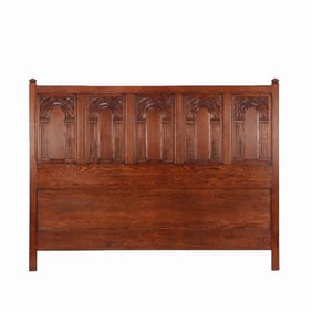 A Gothic style carved oak king size bed C 1980.