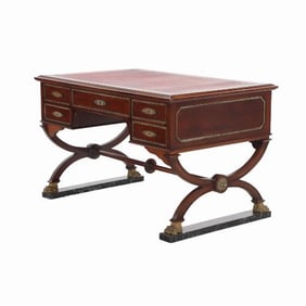 A French Empire style leather top mahogany writing desk C 1890.