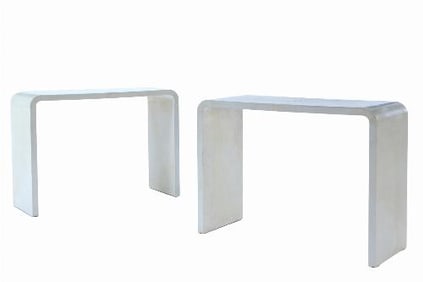A pair of parchment covered waterfall console tables in the manner of Jean-Michel Frank .