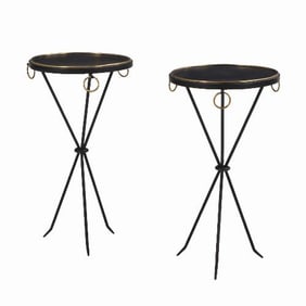 A pair of painted iron drinks tables in the manner of Jean-Michel Frank .