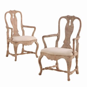 A pair of Swedish Rococo carved and whitewashed walnut armchairs 18th C style.