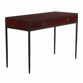 An iron and leather writing desk in the manner of Jean-Michel Frank .