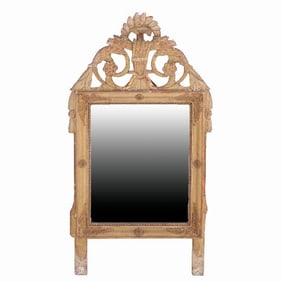 A French Louis XVI style carved and giltwood mirror early 19th C.
