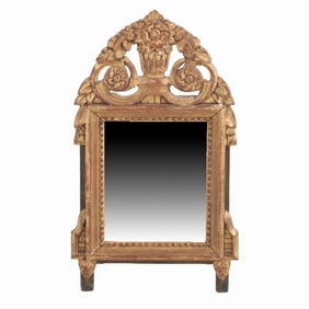 A French Louis XVI style carved and giltwood mirror C 1810.