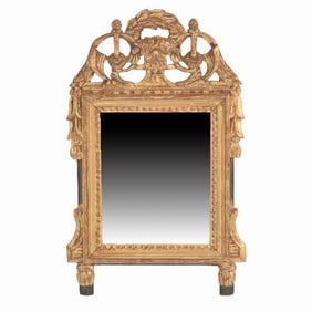 A French Louis XVI style carved and giltwood mirror C 1810 .