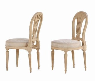 A pair of French Louis XVI style painted side chairs C 1900.