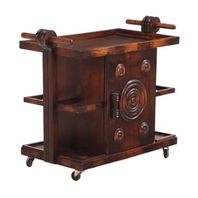 FRENCH OAK ROLLING BAR CART HAVING DOORS ON EITHER SIDE IN THE MANNER OF CHARLES DUDOUYT C 1940.