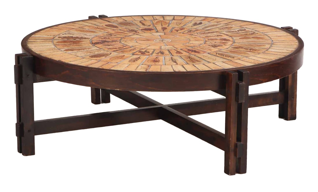 ROUND FRENCH TILE TOP COFFEE TABLE WITH STRETCHER BASE C 1970 SIGNED ROGER CAPRON.: Round French tile top coffee table with stretcher base C 1970 signed Roger Capron. Ht: 13" Wd: 42" Dpth: 42"
