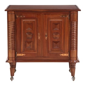 FRENCH MAHOGANY SERVER HAVING TURNED AND GEOMETRIC ELEMENTS IN THE MANNER OF CHARLES DUDOUYT C 1940.