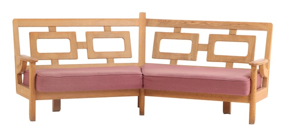 FRENCH OAK ANGELED SOFA WITH GEOMETRIC BACK PANELS BY GUILLERME ET CHAMBRON C 1960.