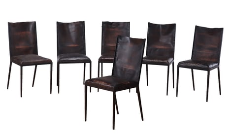 SIX IRON AND LEATHER DINING CHAIRS IN THE MANNER OF JEAN-MICHEL FRANK.
