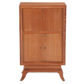 FRENCH CERUSED OAK FALL FRONT BAR CABINET HAVING A MIRRORED UPPER SECTION ABOVE TWO DOORS C 1945.