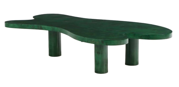BIOMORPHIC WOOD COFFEE TABLE HAVING ROUND LEGS AND A BURL WOOD TOP WITH A GREEN TINT.