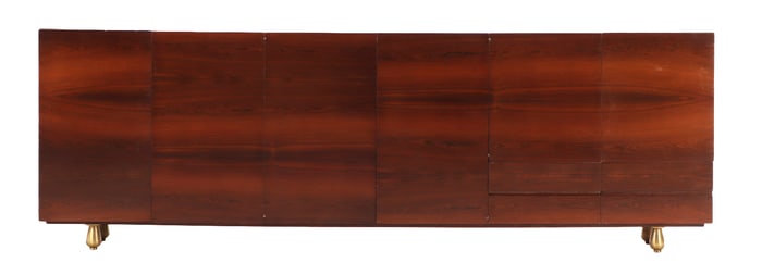 SIX DOOR ROSEWOOD SIDEBOARD HAVING BOOKMATCHED VENEERED FACE AND BRONZE FEET C 1950.