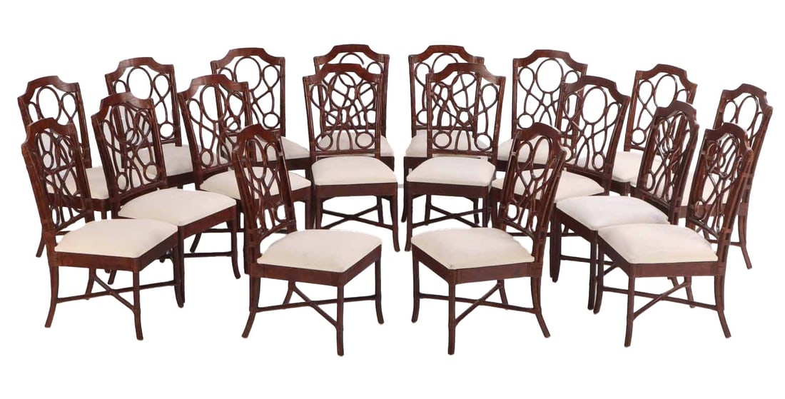 EIGHTEEN RATTAN DINING CHAIRS IN THE MANNER OF BILLY HAINES. (1 of 6)
