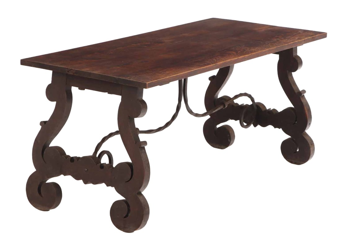 SPANISH OAK TABLE HAVING A SOLID TOP AND AN IRON STRETCHER C 1910. (1 of 5)