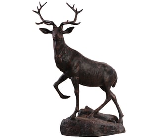 LARGE CAST IRON SCULPTURE OF A STAG RAISED ON A ROCK.