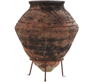LARGE TERRACOTTA OLIVE JAR ON IRON STAND.