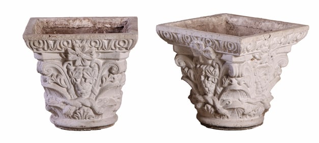 A PAIR OF HIGHLY DECORATED CAST STONE GARDEN PLANTERS.