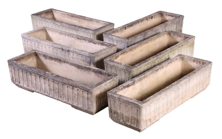 ONE OF TWO PAIRS OF FRENCH CAST STONE PLANTERS WITH A HINT OF ART DECO DETAILING C 1950.