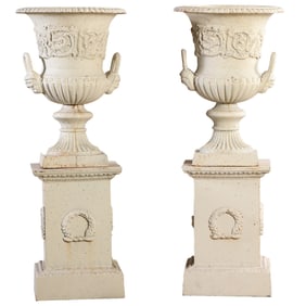 44" PAIR OF CAST IRON DECORATED CAMPAGNA FORM GARDEN URNS ON SEPARATE WREATH DECORATED CAST IRON