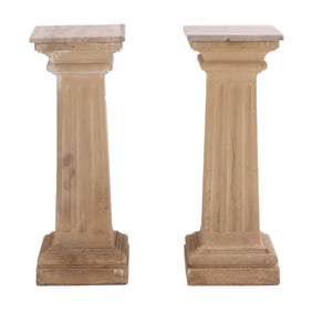 A PAIR OF CAST STONE FLUTED PEDESTALS WITH TRAVERTINE TOPS.
