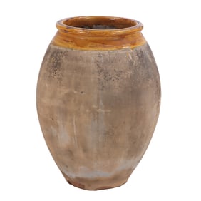 A TALL PARTIALLY GLAZED FRENCH EARTHENWARE BIOT OLIVE JAR CIRCA 1900.