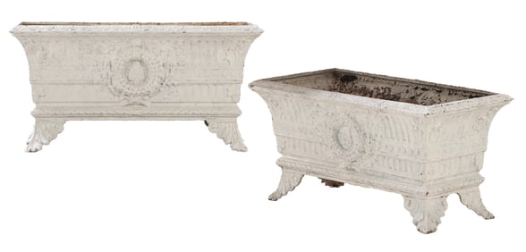 A PAIR OF CAST IRON FRENCH PLANTERS DECORATED WITH WREATHS CIRCA 1930.