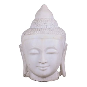 A CARVED MARBLE BUDDHA STATUE.