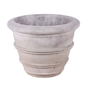 A CAST STONE PLANTER.
