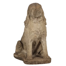 A 29" CAST STONE FIGURE OF A SEATED DOG.
